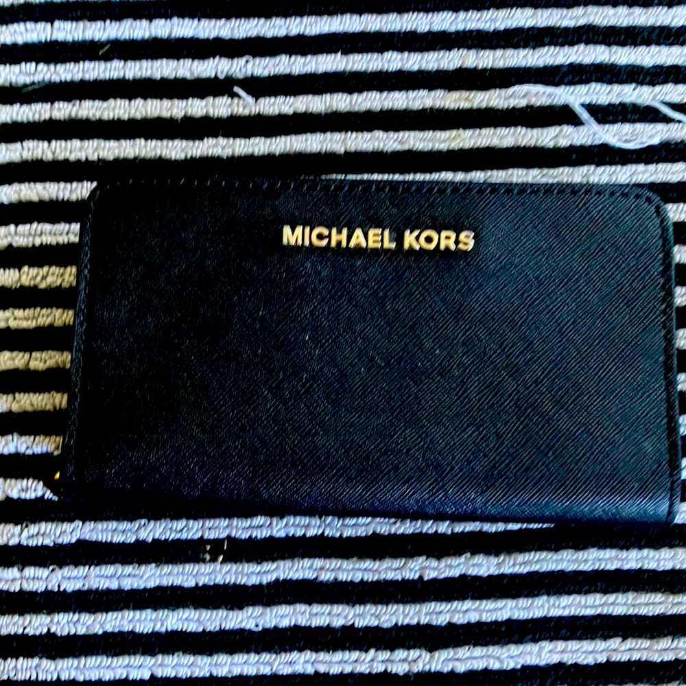 Michael Kors black small wallet perfect condition.  Awesome durable made well!